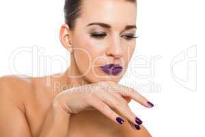 Graceful attractive woman with purple lips and nails