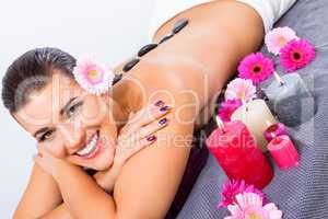 Beautiful woman enjoying a hot stone massage