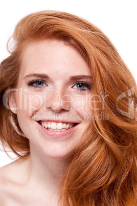 beautiful young smiling woman with red hair and freckles isolated