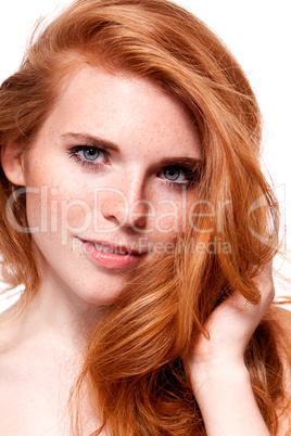 beautiful young smiling woman with red hair and freckles isolated