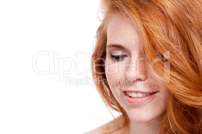 beautiful young redhead woman with freckles portrait