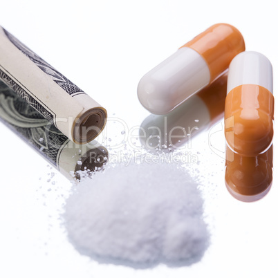 illegal pharmaceutical pills and drugs money on mirror