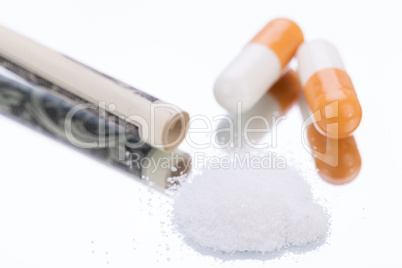 illegal pharmaceutical pills and drugs money on mirror