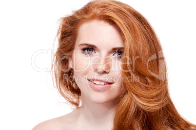 beautiful young redhead woman with freckles portrait