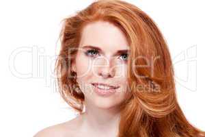beautiful young redhead woman with freckles portrait