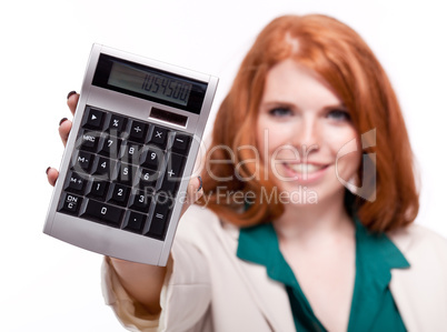 attractive smiling redhead business woman with calculator isolated