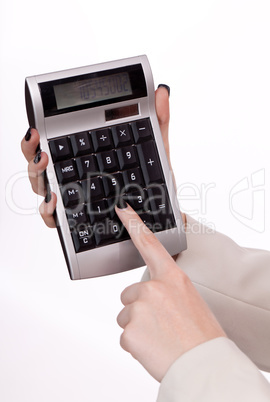 attractive smiling redhead business woman with calculator isolated