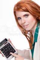 attractive smiling redhead business woman with calculator isolated