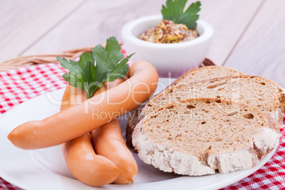tasty sausages frankfurter with grain bread