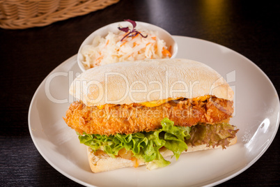 Burger with golden crumbed chicken breast