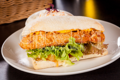 Burger with golden crumbed chicken breast