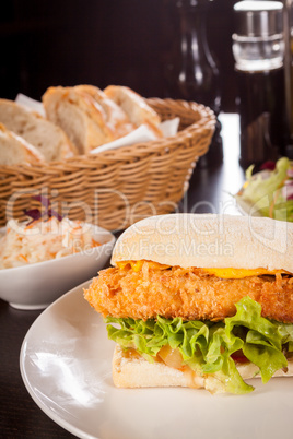 Burger with golden crumbed chicken breast