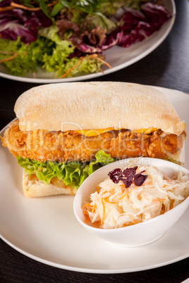 Burger with golden crumbed chicken breast