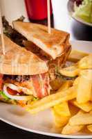 Club sandwich with potato French fries