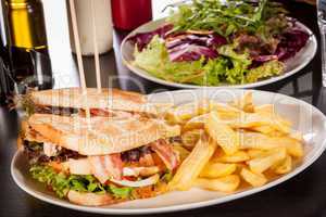 Club sandwich with potato French fries