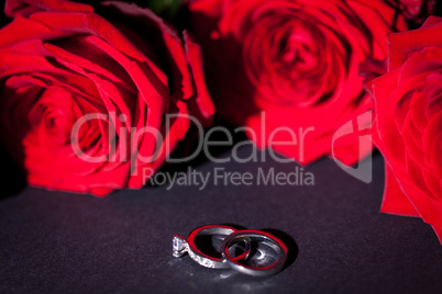Engagement ring with a bunch of red roses
