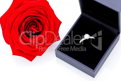 Engagement ring with a bunch of red roses