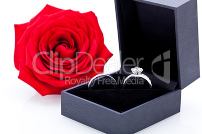 Engagement ring with a bunch of red roses