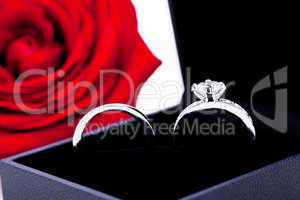 Engagement ring with a bunch of red roses