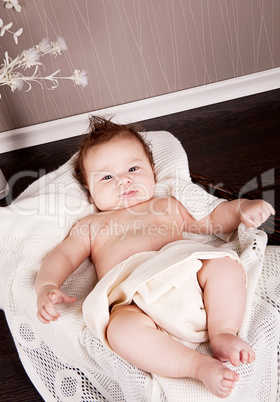 sweet little baby infant toddler on blanket in basket