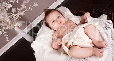 sweet little baby infant toddler on blanket in basket