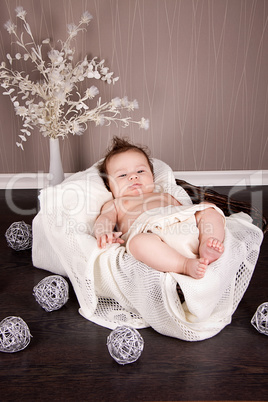 sweet little baby infant toddler on blanket in basket