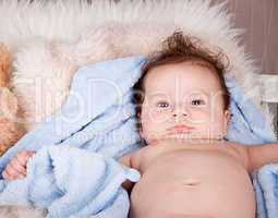 cute little baby todler infant lying on blanket