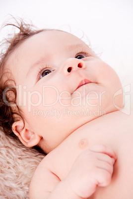 cute little baby infant toddler on white blanket portrait