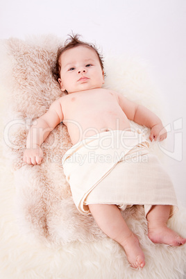 cute little baby infant toddler on white blanket portrait