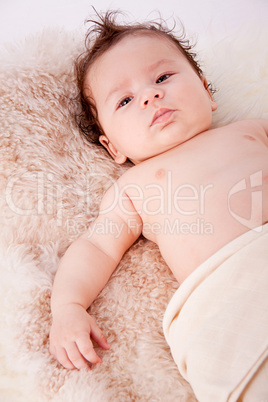 cute little baby infant toddler on white blanket portrait