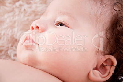 cute little baby infant toddler on white blanket portrait