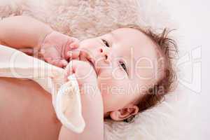 cute little baby infant toddler on white blanket portrait