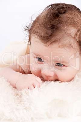 cute little baby infant toddler on white blanket portrait