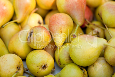 fresh tasty pear fruit on market outdoor in summer