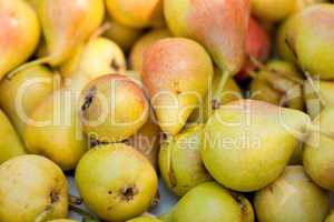 fresh tasty pear fruit on market outdoor in summer