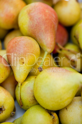 fresh tasty pear fruit on market outdoor in summer