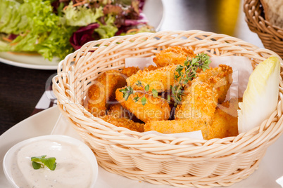 Crumbed chicken nuggets in a basket