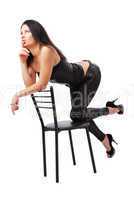 Sexy woman thinking on the chair