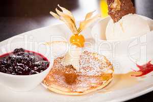 tasty sweet pancakes with vanilla icecream and topping