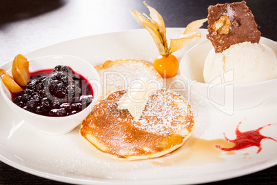 tasty sweet pancakes with vanilla icecream and topping