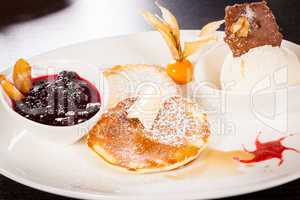 tasty sweet pancakes with vanilla icecream and topping