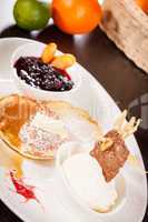 tasty sweet pancakes with vanilla icecream and topping