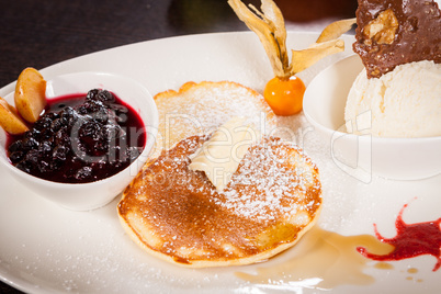 tasty sweet pancakes with vanilla icecream and topping