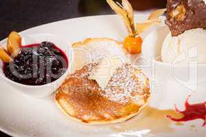 tasty sweet pancakes with vanilla icecream and topping