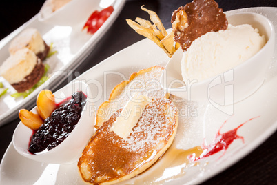 tasty sweet pancakes with vanilla icecream and topping