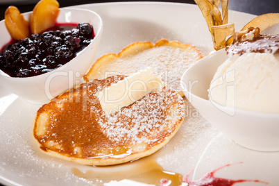 tasty sweet pancakes with vanilla icecream and topping