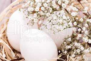 Plain undecorated Easter eggs in a nest