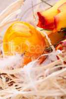 Vivid orange Easter egg with a gerbera and rose