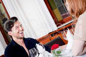happy smiling couple in restaurant