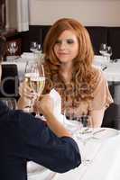 Waiter serving a couple in a restaurant